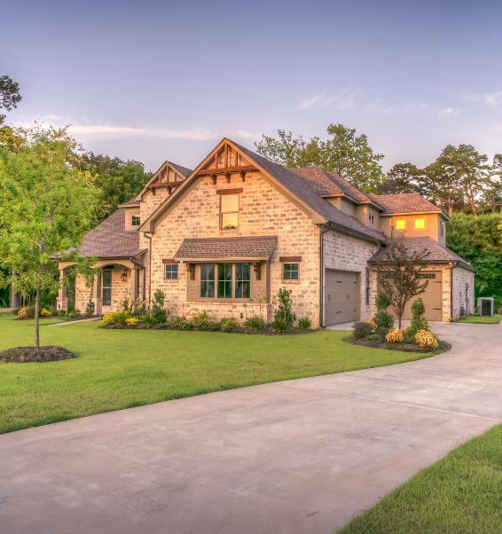 exterior of a luxury home with trees surrounding 2 valley stream ny